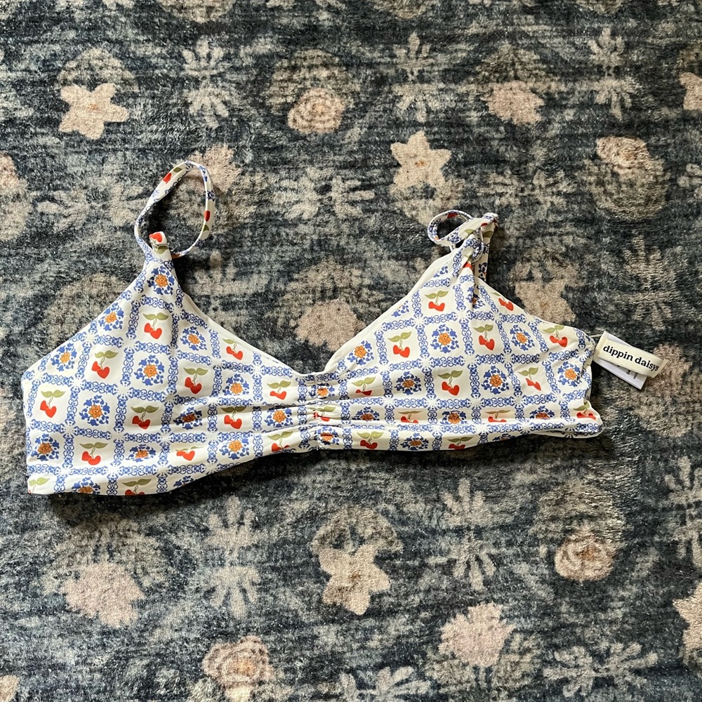 Dippin' Daisy's White Bikini Top with Blue Tile and Red Accent Print